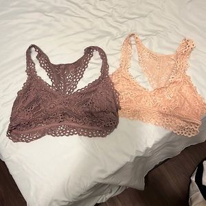 Two bralette’s: one purple, one peach. Both size M/L